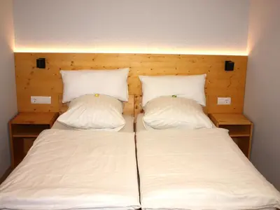 Ein Bett oder Betten in einem Zimmer der Unterkunft Apartment Wohlfühloase für Natur- und Gartenliebhaber by Interhome