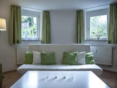 Ein Bett oder Betten in einem Zimmer der Unterkunft Apartment Wohlfühloase für Natur- und Gartenliebhaber by Interhome