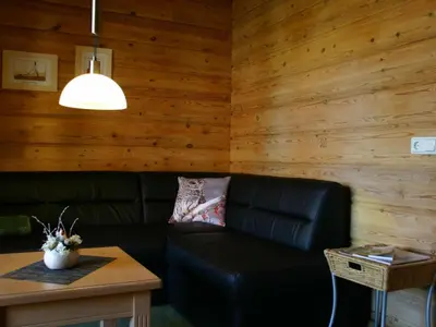 Ein Sitzbereich in der Unterkunft Apartment Gemütliches Blockhaus in Waldrandlage mit Sauna by Interhome