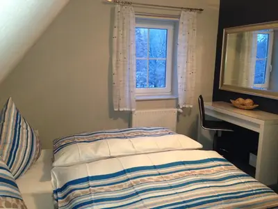 Ein Bett oder Betten in einem Zimmer der Unterkunft Ferienwohnung Hellerling