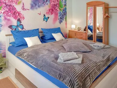 Ein Bett oder Betten in einem Zimmer der Unterkunft Bines
