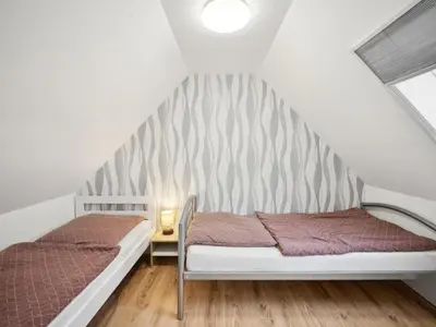 Ein Bett oder Betten in einem Zimmer der Unterkunft Harzblick