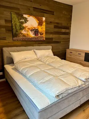 Ein Bett oder Betten in einem Zimmer der Unterkunft Stadtblick Ferienwohnung