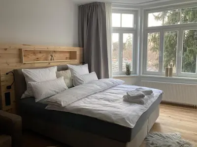 Ein Bett oder Betten in einem Zimmer der Unterkunft Villa Schlossblick II - Zeit zum Genießen in exklusivem Studio 