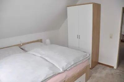 Ein Bett oder Betten in einem Zimmer der Unterkunft Ferienwohnung Martin II