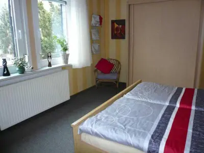 Ein Bett oder Betten in einem Zimmer der Unterkunft Ferienwohnungen Happe