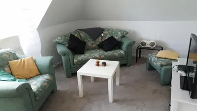 Ein Sitzbereich in der Unterkunft Ferienwohnung Villa Seyfried