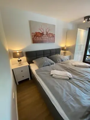 Ein Bett oder Betten in einem Zimmer der Unterkunft luxuriöses Ferienapartment 