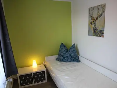 Ein Bett oder Betten in einem Zimmer der Unterkunft Apartment Wohnung Julius 5 - gemütlich und kinderfreundlich by Interhome
