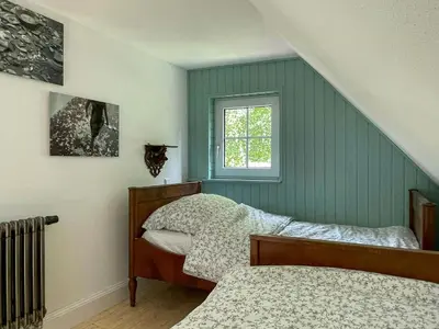 Ein Bett oder Betten in einem Zimmer der Unterkunft Historic Lodge With Brocken View In Harz