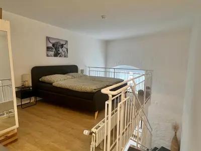 Ein Bett oder Betten in einem Zimmer der Unterkunft AltstadtTraum Ritter Ramm
