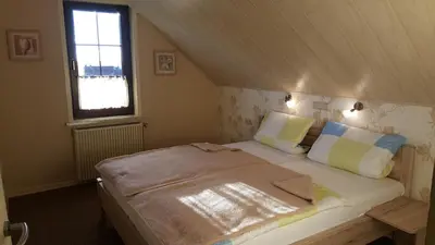 Ein Bett oder Betten in einem Zimmer der Unterkunft Haus am Kurpark