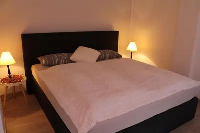 Ein Bett oder Betten in einem Zimmer der Unterkunft Ferien im Laden