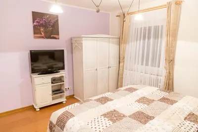 Ein Bett oder Betten in einem Zimmer der Unterkunft Ferienwohnung-Schwanke