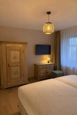 Ein Bett oder Betten in einem Zimmer der Unterkunft Bergflamme - Ihr Ferienhaus im Harz mit Sauna