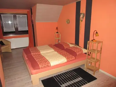 Ein Bett oder Betten in einem Zimmer der Unterkunft Ferienhaus Schulze