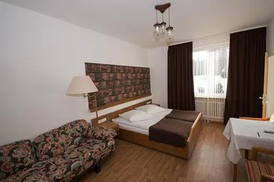 Ein Bett oder Betten in einem Zimmer der Unterkunft Hotel & Hostel Drei Bären