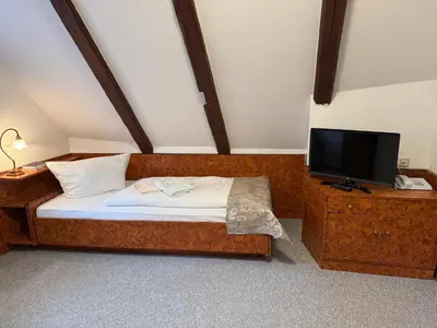 Ein Bett oder Betten in einem Zimmer der Unterkunft Gasthaus Kupfer