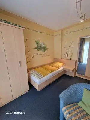 Ein Bett oder Betten in einem Zimmer der Unterkunft Cafe Steffens