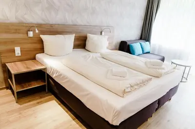 Ein Bett oder Betten in einem Zimmer der Unterkunft Appartements Am Kranichsee