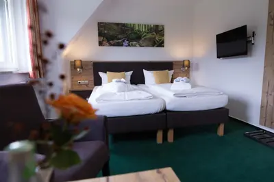 Ein Bett oder Betten in einem Zimmer der Unterkunft BSW-Erlebnishotel Festenburg