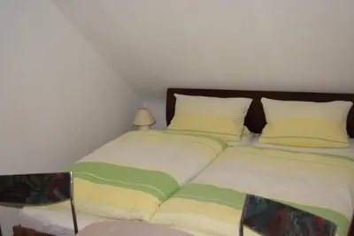 Ein Bett oder Betten in einem Zimmer der Unterkunft Ferienwohnung Schmidt