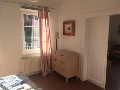Ein Bett oder Betten in einem Zimmer der Unterkunft Ferienwohnung im Blauen Haus