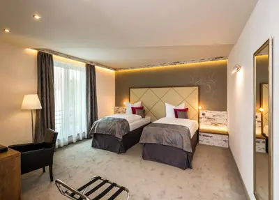 Ein Bett oder Betten in einem Zimmer der Unterkunft Hotel Allegro