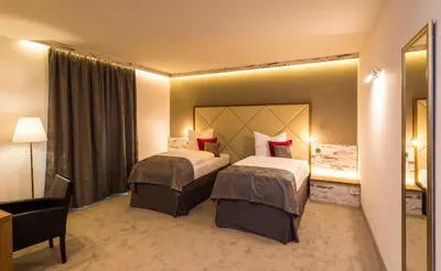 Ein Bett oder Betten in einem Zimmer der Unterkunft Hotel Allegro