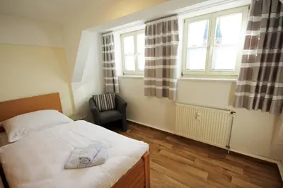 Ein Bett oder Betten in einem Zimmer der Unterkunft Ferienwohnung Ballstrasse 28