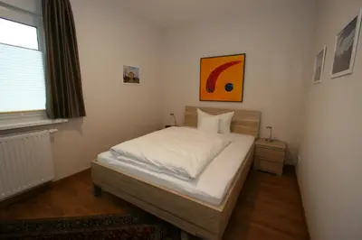 Ein Bett oder Betten in einem Zimmer der Unterkunft Ferienhaus Sonnenwinkel