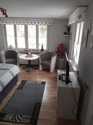 Ein Sitzbereich in der Unterkunft Haus Hubertus