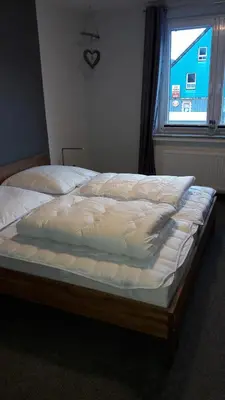 Ein Bett oder Betten in einem Zimmer der Unterkunft Haus Steeg