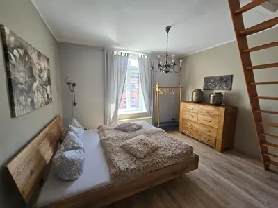 Ein Bett oder Betten in einem Zimmer der Unterkunft Palais Picard Westflügel