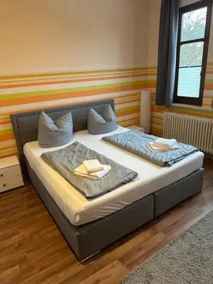 Ein Bett oder Betten in einem Zimmer der Unterkunft Ferienwohnung Baars