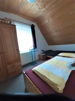 Ein Bett oder Betten in einem Zimmer der Unterkunft Ferienwohnung Stricker 3/3