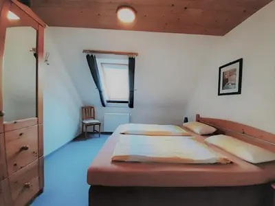 Ein Bett oder Betten in einem Zimmer der Unterkunft Ferienwohnung Stricker 3/2