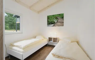 Ein Bett oder Betten in einem Zimmer der Unterkunft Ferienhausdorf Thale