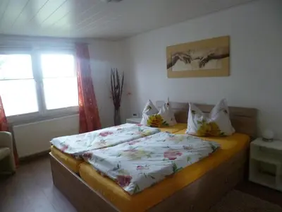 Ein Bett oder Betten in einem Zimmer der Unterkunft Ferienhaus ANNE