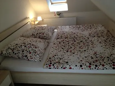 Ein Bett oder Betten in einem Zimmer der Unterkunft Ferienwohnung Unikat