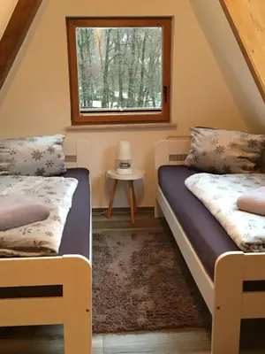 Ein Bett oder Betten in einem Zimmer der Unterkunft Ferienhaus am Rachental