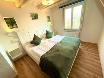 Ein Bett oder Betten in einem Zimmer der Unterkunft Family Club Harz
