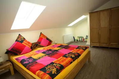 Ein Bett oder Betten in einem Zimmer der Unterkunft Ferienhaus Gottersitz