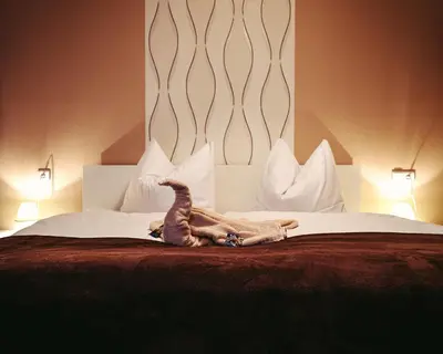 Ein Bett oder Betten in einem Zimmer der Unterkunft Ferienwohnungen an der Wassermühle