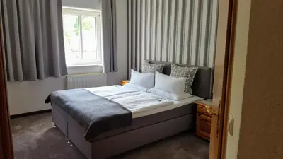 Ein Bett oder Betten in einem Zimmer der Unterkunft Kurhotel Bad Suderode