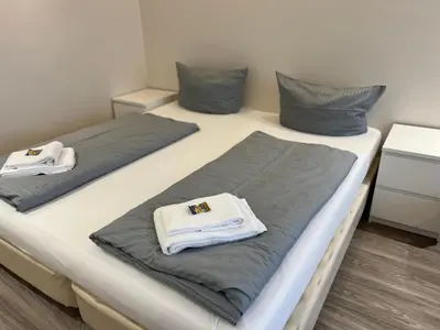 Ein Bett oder Betten in einem Zimmer der Unterkunft Haus Vier Jahreszeiten am See HS 582