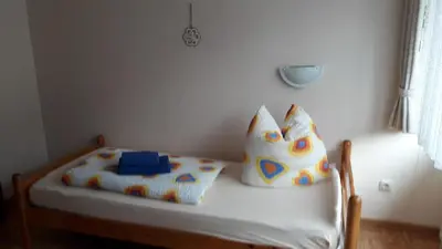 Ein Bett oder Betten in einem Zimmer der Unterkunft Ferienwohnungen Steeg