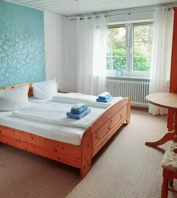 Ein Bett oder Betten in einem Zimmer der Unterkunft Ferienwohnung Rieger 1