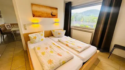 Ein Bett oder Betten in einem Zimmer der Unterkunft Ferienhaus Goethestrasse