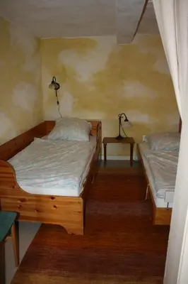 Ein Bett oder Betten in einem Zimmer der Unterkunft Apartments Café Brennnessel